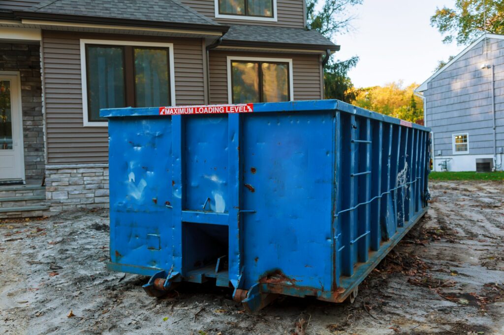 Dumpsters being full with garbage in a city. Dumpsters being full with garbage